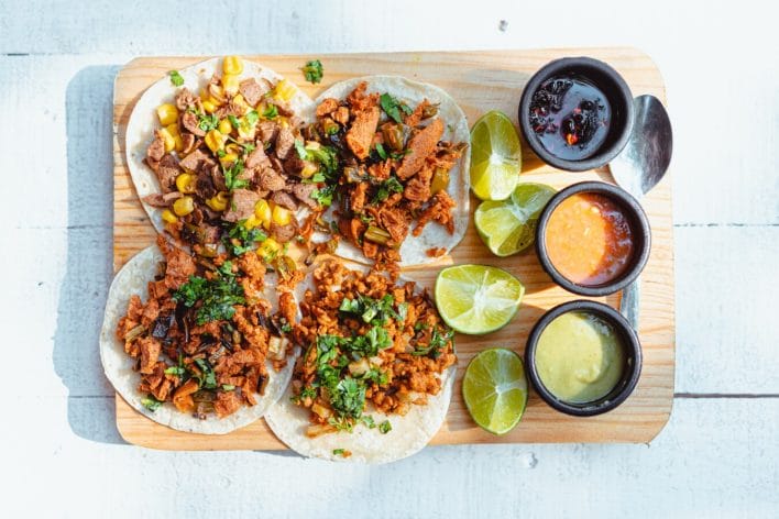 Close-Up Shot of Tacos on a Wooden Tray